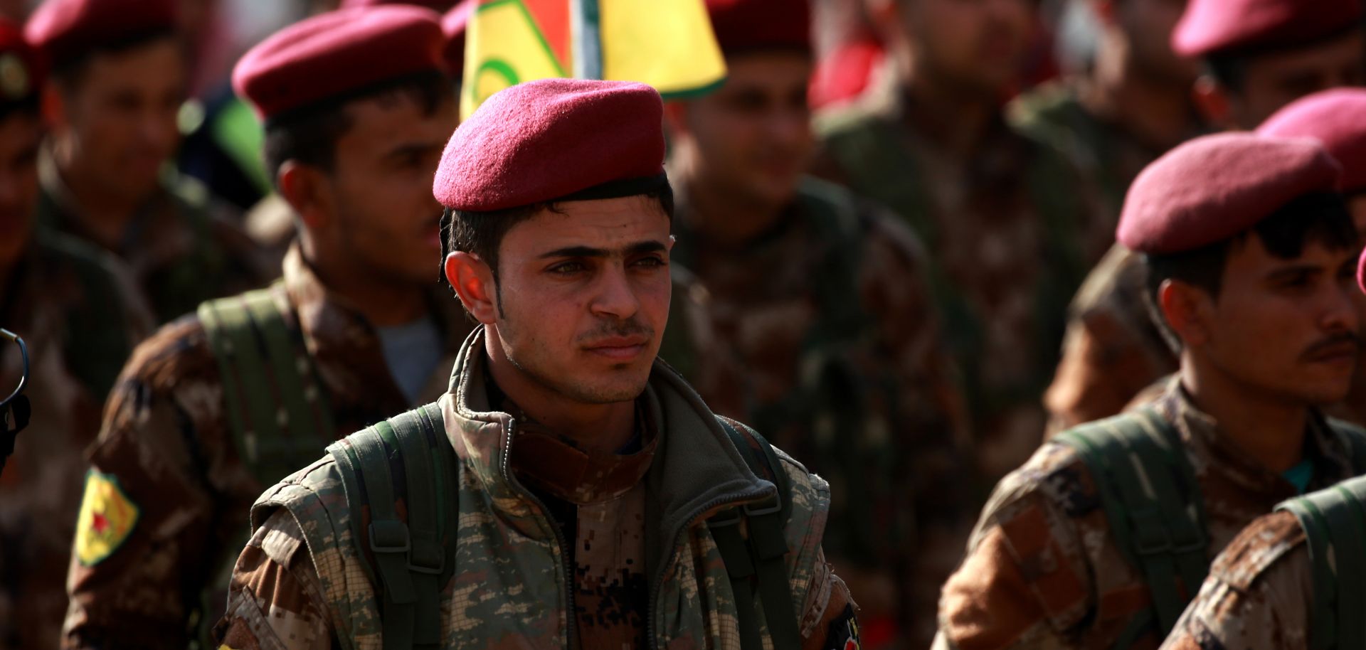 Military police members of the Kurdish People's Protection Units march in al-Muabbadah in northern Syria on Feb. 24, 2018.