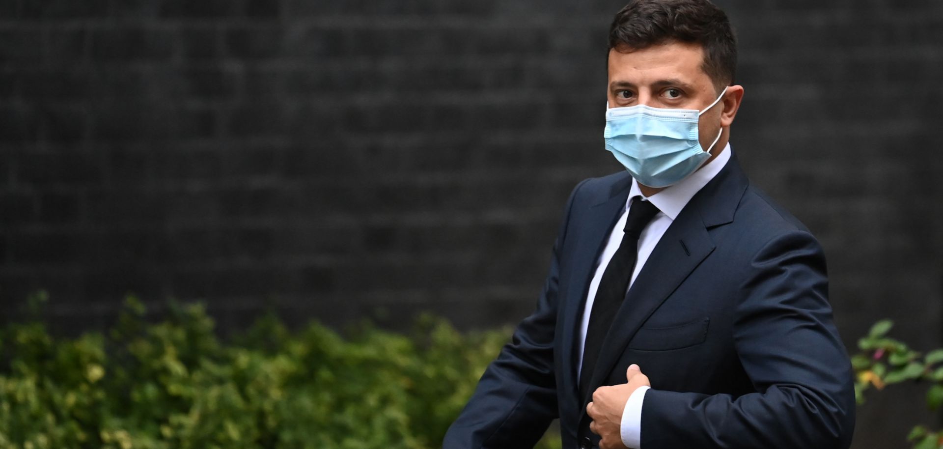 Ukrainian President Volodymyr Zelenskiy wears a facemask as he arrives to meet with U.K. Prime Minister Boris Johnson in London on Oct. 8, 2020. 