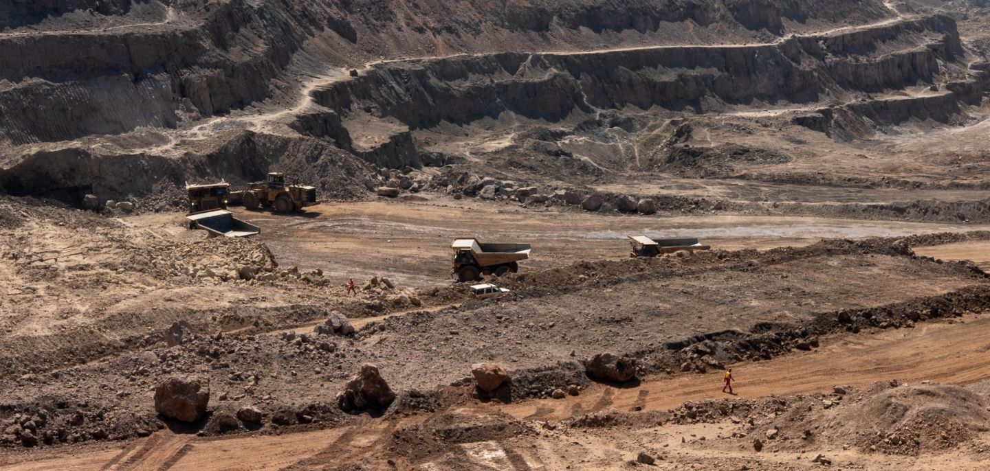 Trucks haul away ore from a pit in the Chinese-owned Tenke Fungurume Mine, one of the largest copper and cobalt mines in the world, in southeastern Democratic Republic of the Congo on June 17, 2023.