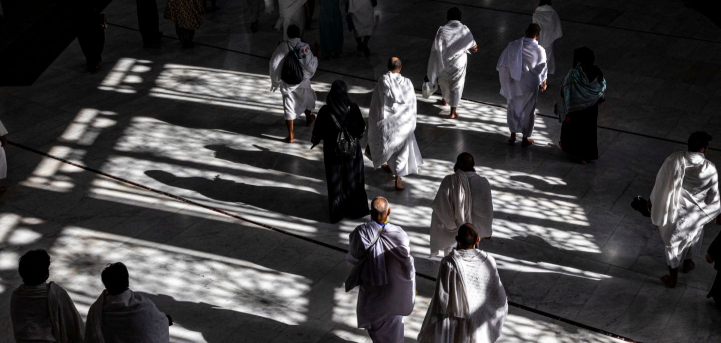 Muslim pilgrims walk at the Grand Mosque in Saudi Arabia's holy city of Mecca on July 6, 2022 during the annual hajj pilgrimage. 