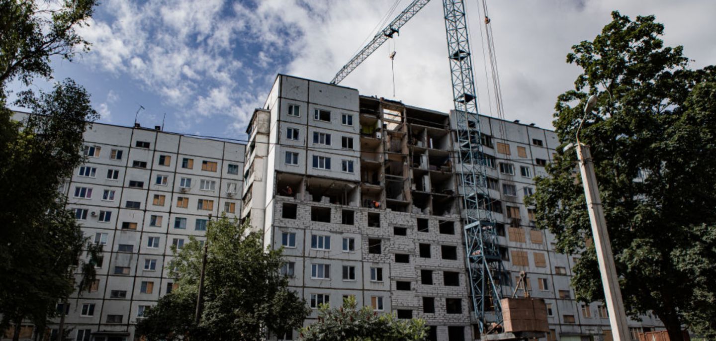City authorities and businesses rebuild residential buildings damaged by Russian shelling in Kharkiv, Ukraine, on July 12, 2023.