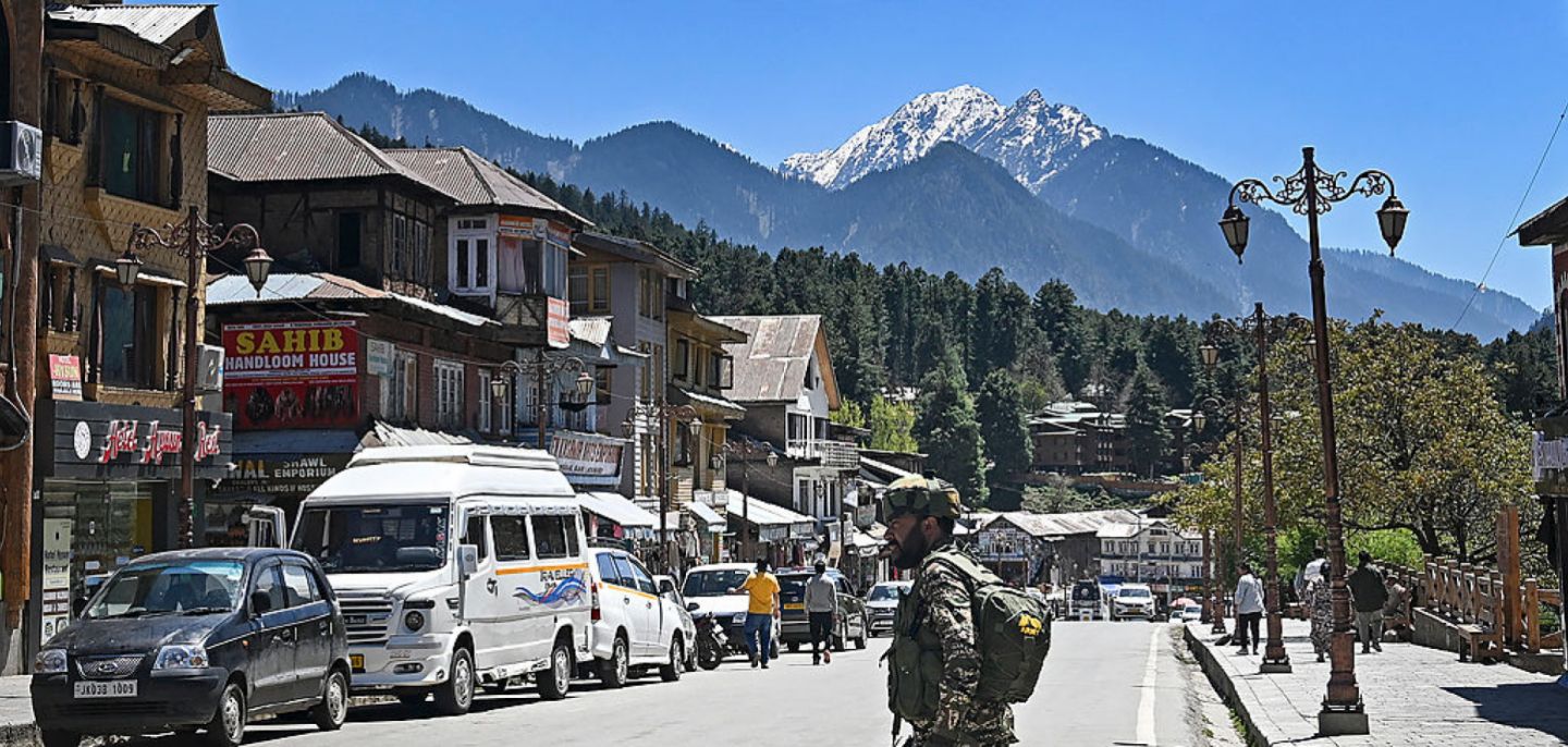 An Indian paramilitary trooper patrols a market area in Pahalgam, south of Srinagar, in India-held Kashmir, on April 29, 2025. 