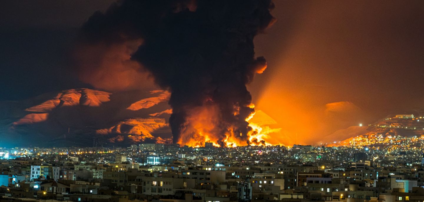 Smoke and flames rise at the site of airstrikes on an oil depot in Tehran, Iran, on March 7, 2026.