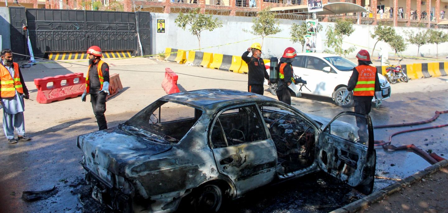 Firefighters douse a car at the suicide blast site in Islamabad, Pakistan, on Nov. 11, 2025. 