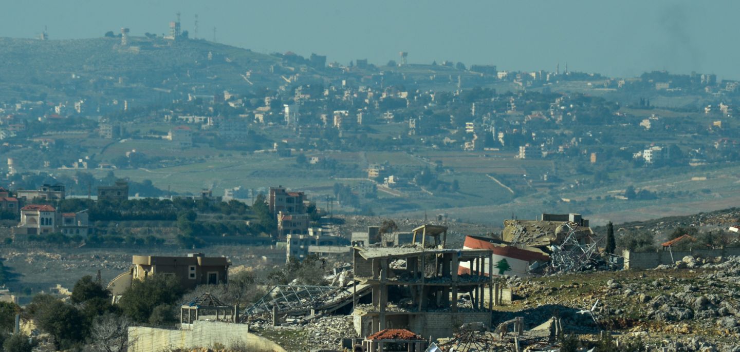 A collapsed water tank painted with the Lebanese flag is seen in the ruins of a village in southern Lebanon, located near the border with Israel, on Jan. 7, 2025.