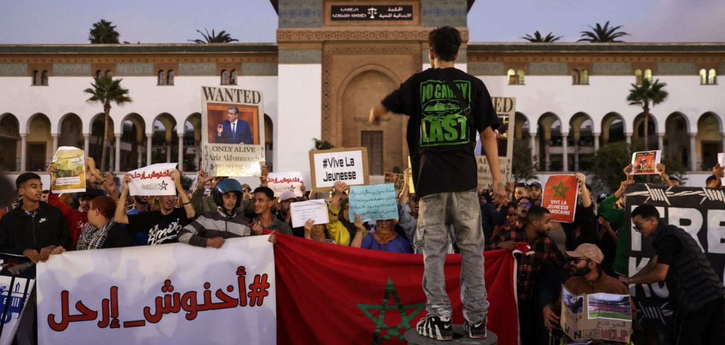 Demonstrators lift banners during a youth-led protest demanding reforms to public healthcare and education in Casablanca, Morocco, on Oct. 6, 2025.