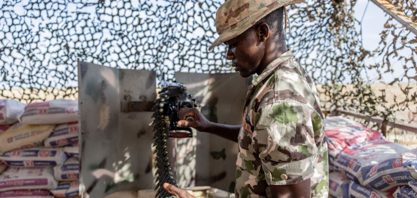 A Nigerian soldier stands guard at a checkpoint at the entrance to Monguno, Borno state, Nigeria, on July 4, 2025. 
