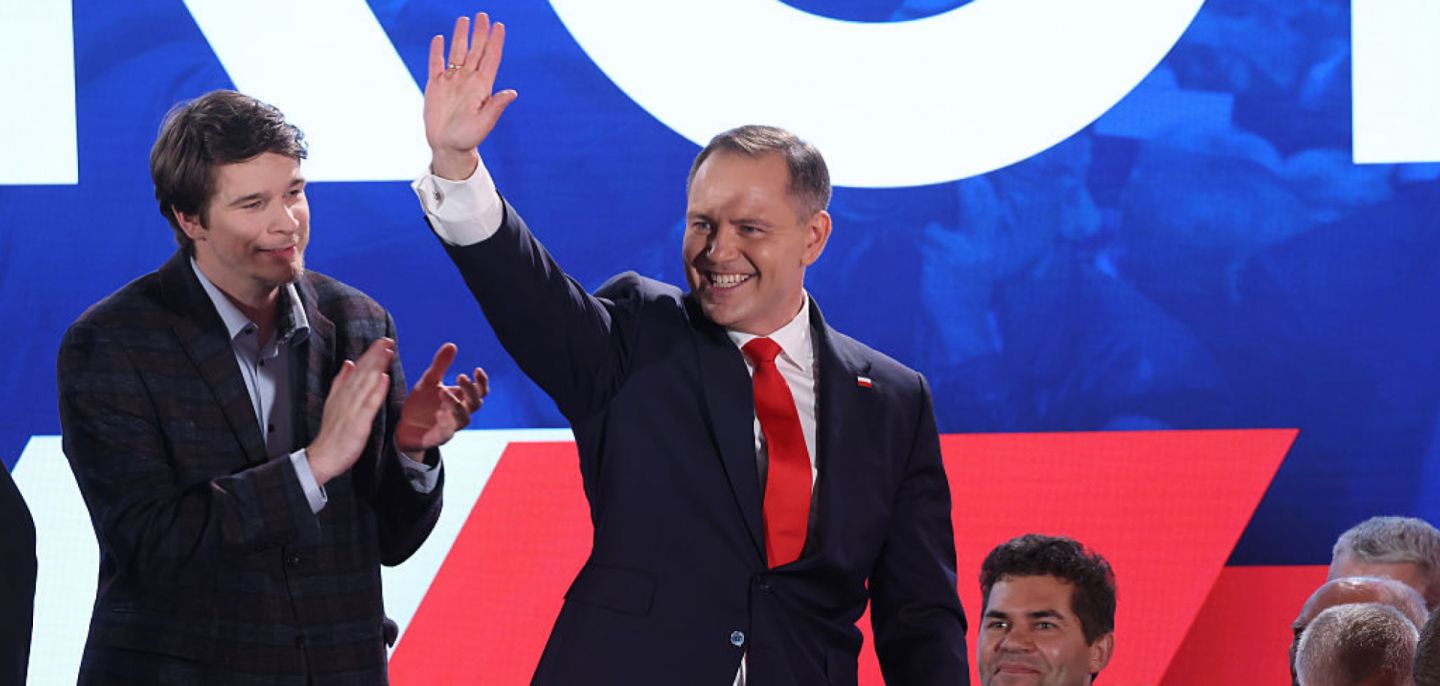 Right-wing opposition candidate Karol Nawrocki waves to supporters in Warsaw, Poland, following the presidential runoff election on June 1, 2025.