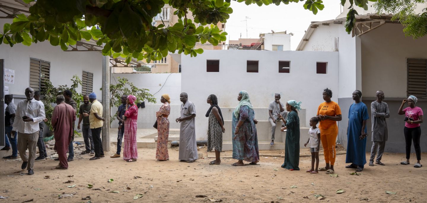 Voters wait in line outside a voting station in Dakar on Nov. 17, 2024, during Senegal's parliamentary elections.