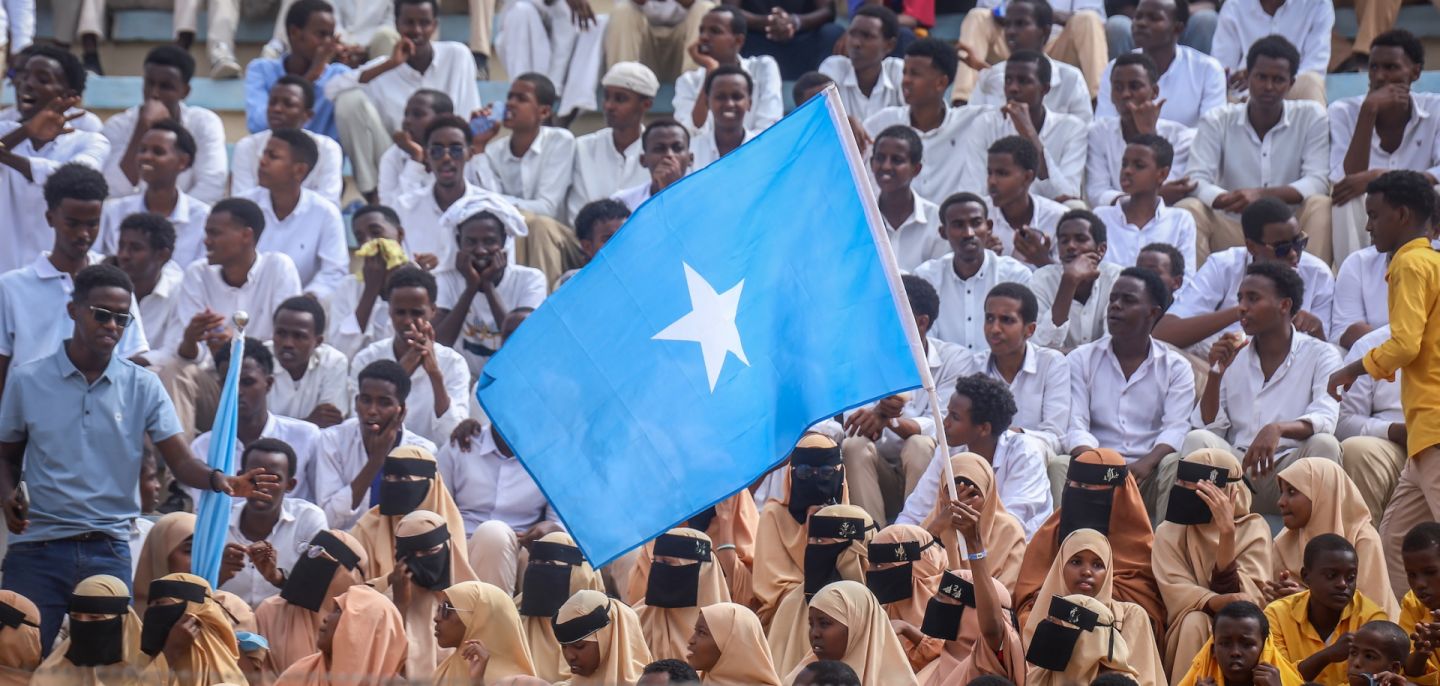 Residents wave Somali flags as they attend a rally denouncing Israel's recognition of the breakaway region of Somaliland at Mogadishu Stadium in Mogadishu, Somalia, on Dec. 30, 2025. 