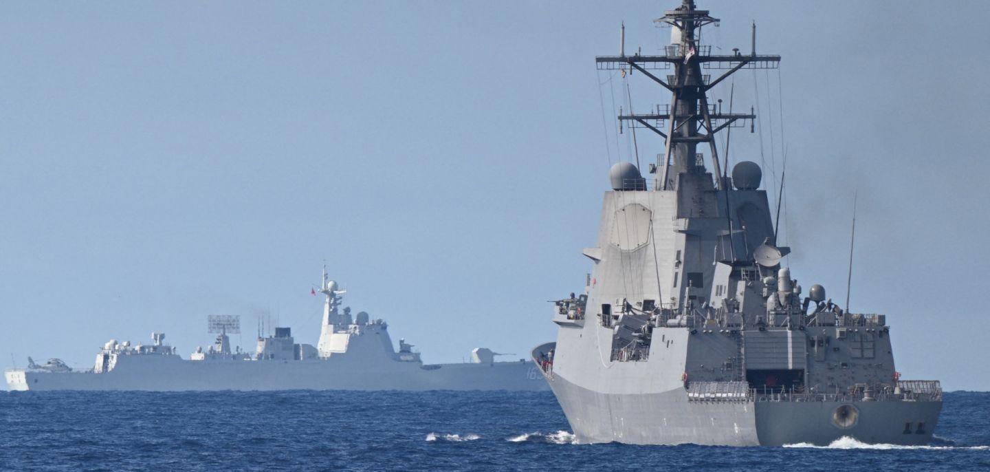 A Chinese navy ship (background left) is seen while an Australian navy ship (right) takes part in a maritime cooperative activity with the Philippines and Canada in the disputed waters of the South China Sea on Sept. 3, 2025. A Chinese navy ship (background left) is seen while an Australian navy ship (right) takes part in a maritime cooperative activity with the Philippines and Canada in the disputed waters of the South China Sea on Sept. 3, 2025.