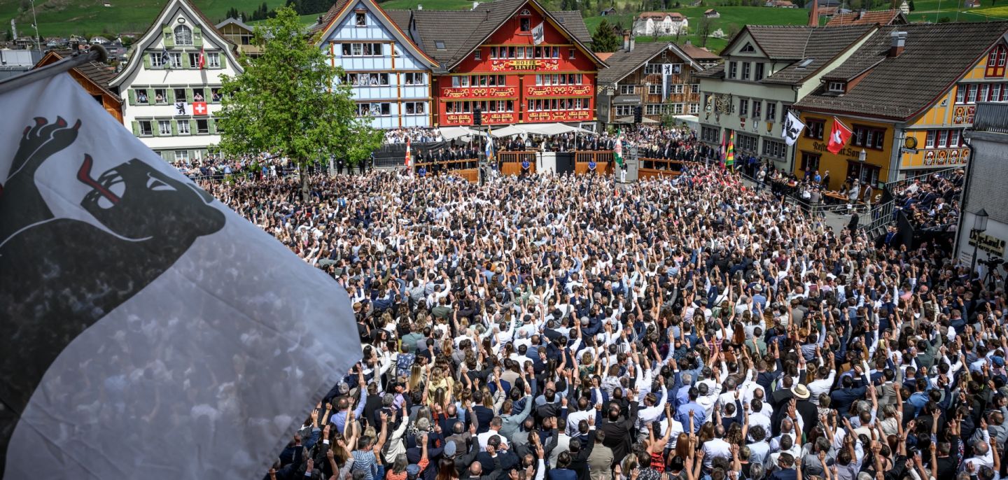 Citizens vote by raising their hands during the Landsgemeinde, a traditional public, non-secret ballot conducted by majority rule, in Appenzell, eastern Switzerland, on April 26.