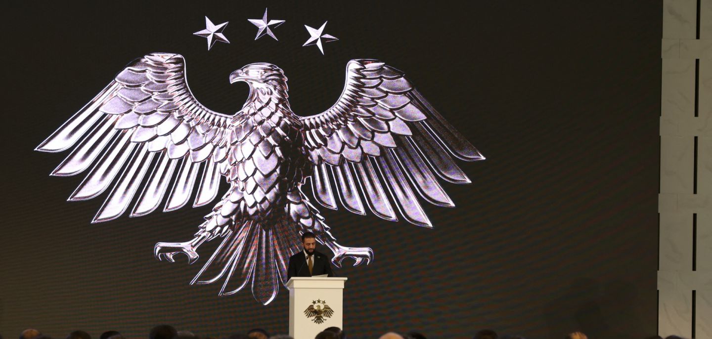 Syria's interim President Ahmad al-Sharaa delivers a speech in Damascus on July 3, 2025, during the unveiling of the "New Visual Identity of the Syrian Arab Republic." 