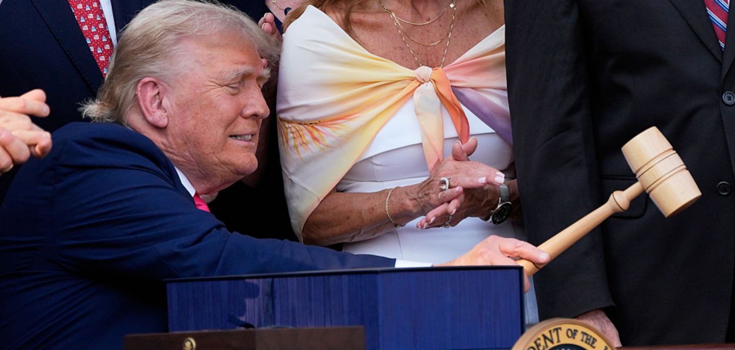 President Donald Trump bangs a gavel after signing a bill into law extending his 2017 tax cuts on July 4 in Washington.