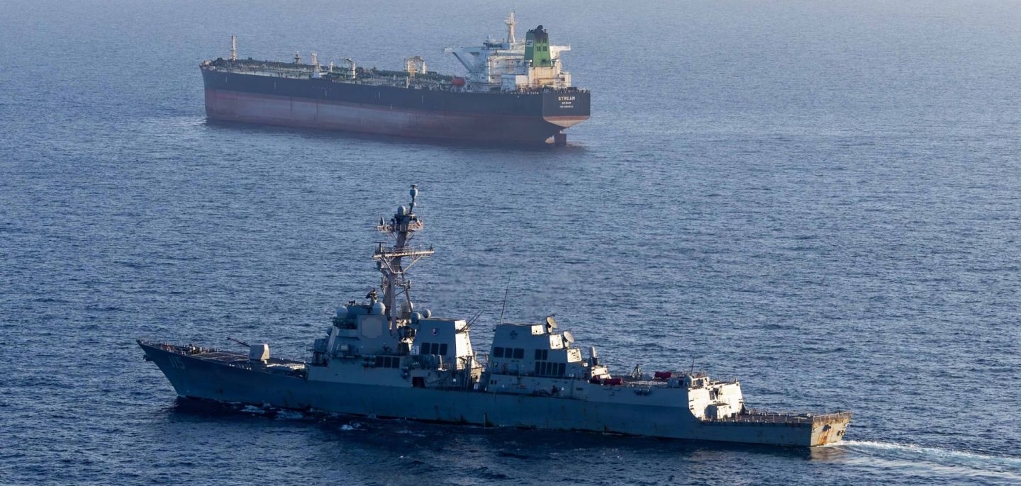 The USS Rafael Peralta implements a maritime blockade against an Iranian-flagged ship attempting to sail toward an Iranian port on April 26, 2026, in the Arabian Sea.