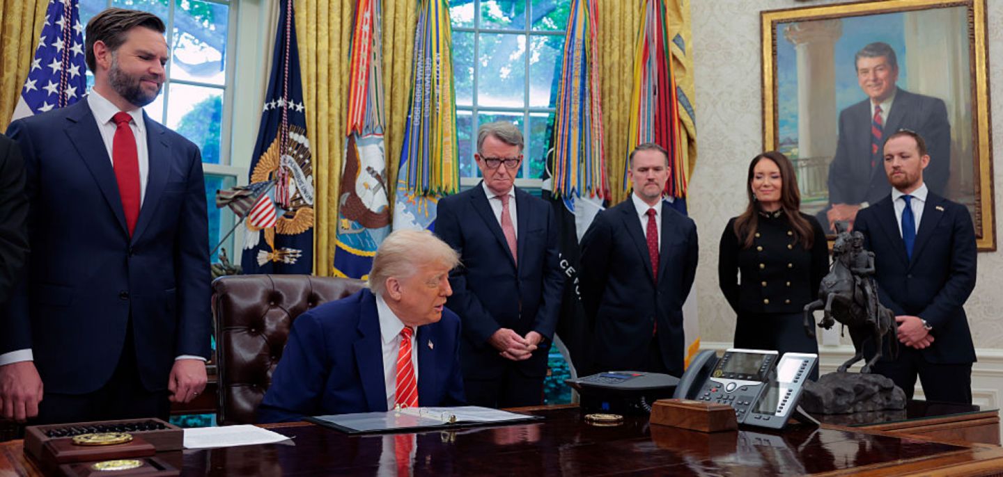 U.S. President Donald Trump -- flanked by Vice President JD Vance (left) and Peter Mandelson, the U.K. ambassador to the United States (right) -- holds a phone call with U.K. Prime Minister Keir Starmer in the Oval Office of the White House on May 8, 2025. 