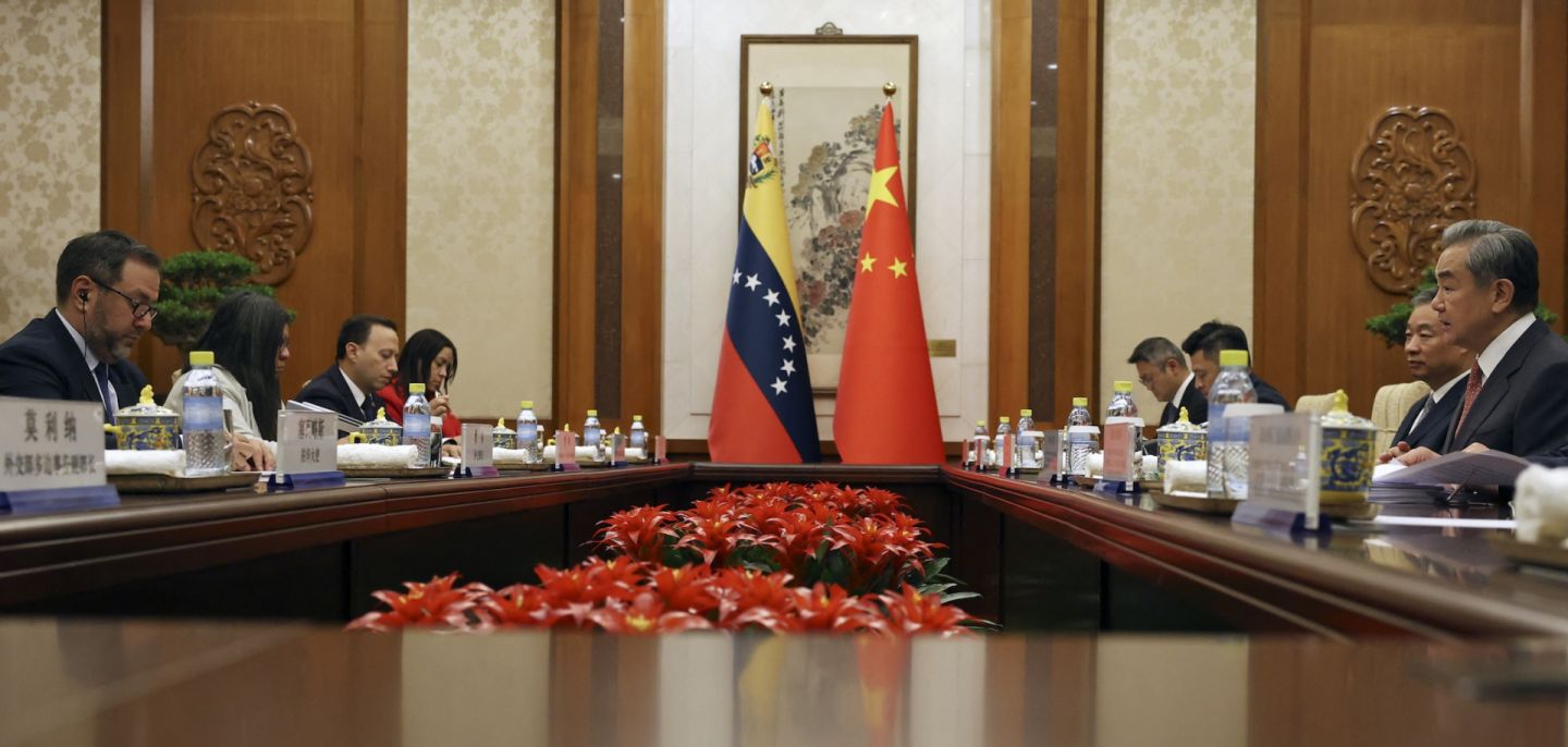 Chinese Foreign Minister Wang Yi (right) and Venezuelan Foreign Minister Yvan Gil (left) attend a meeting in Beijing on May 12, 2025