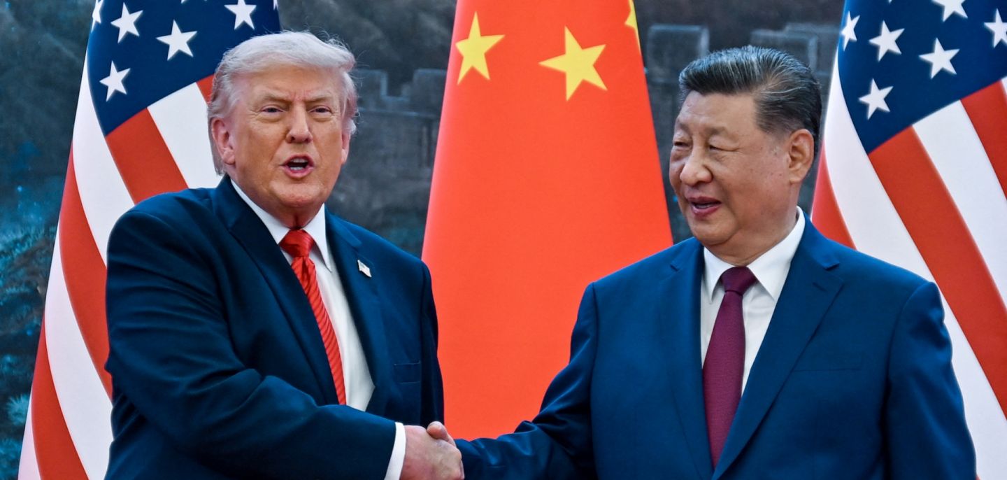 U.S. President Donald Trump (right) shakes hands with Chinese President Xi Jinping at the Great Hall of the People in Beijing on May 14, 2026.