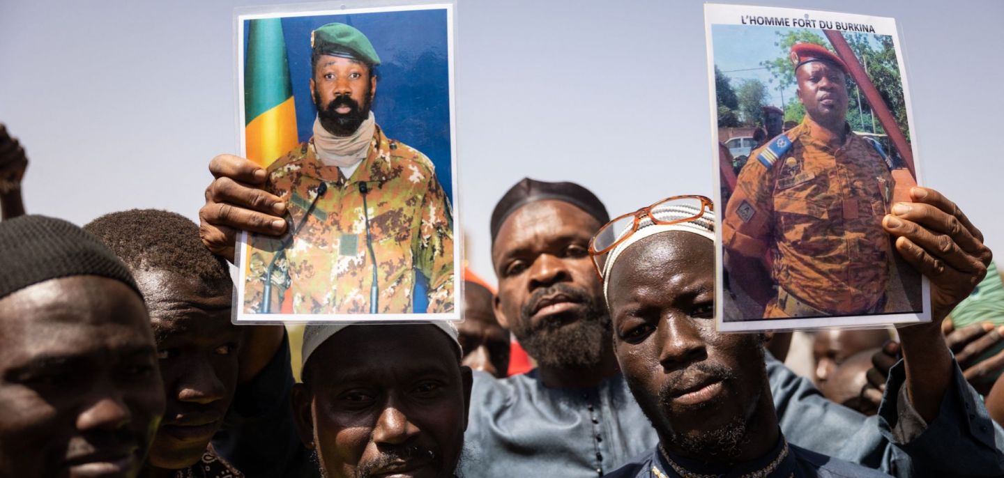 Demonstrators in Ouagadougou, Mali, hold up photos of military leaders Assimi Goita (who seized power for the second time in a May 2021 coup) and Paul-Henri Sandaogo Damiba to show support for the country’s junta on Jan. 25, 2022. 