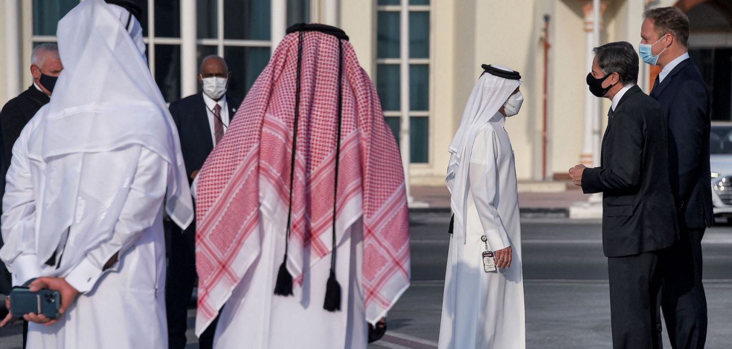 U.S. Secretary of State Antony Blinken speaks with Qatari government officials before boarding an aircraft in Doha on Sept. 8, 2021. 