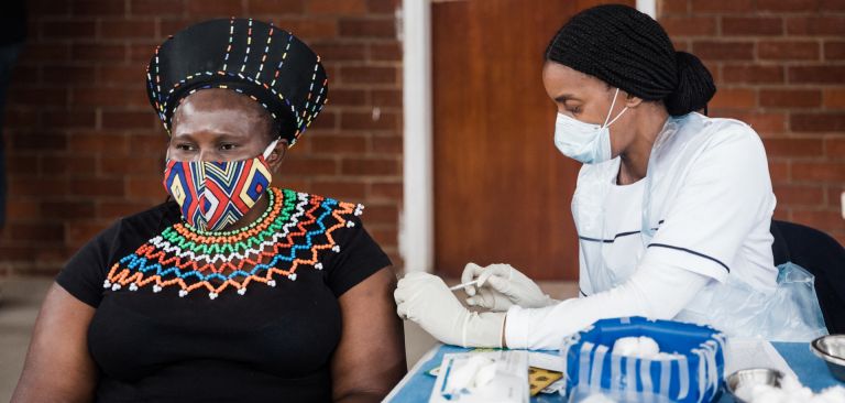 A woman receives a jab of a COVID-19 vaccine in Durban, South Africa, on Sept. 24, 2021. A woman receives a jab of a COVID-19 vaccine in Durban, South Africa, on Sept. 24, 2021.
