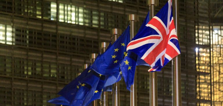EU and British flags Dec. 9, 2020, in front of the headquarters of the European Commission in Brussels.