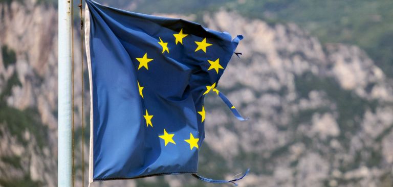 A damaged EU flag is seen in Brenzone, Italy, on Aug. 14, 2019. A damaged EU flag is seen in Brenzone, Italy, on Aug. 14, 2019.