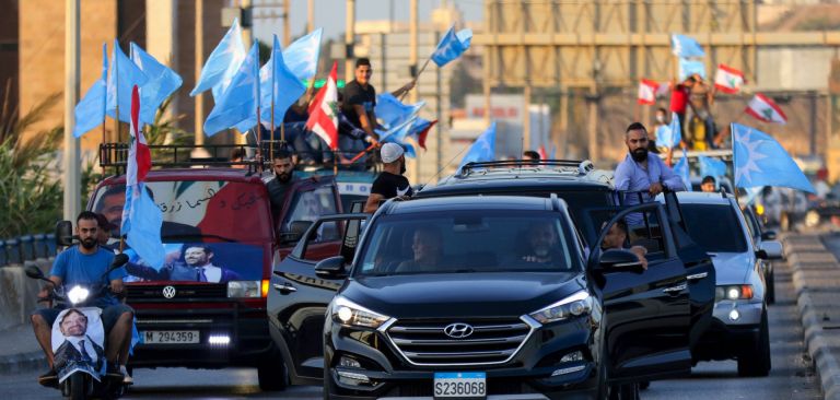 Supporters of Lebanon’s Future Movement party wave the party’s flag alongside the country’s national flag during a parade in the southern Lebanese city of Sidon on Oct. 22, 2020. Supporters of Lebanon’s Future Movement party wave the party’s flag alongside the country’s national flag during a parade in the southern Lebanese city of Sidon on Oct. 22, 2020.
