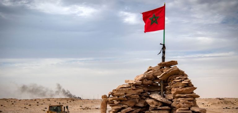 A bulldozer passes by a hilltop manned by Moroccan soldiers in Western Sahara on Nov. 23, 2020. A bulldozer passes by a hilltop manned by Moroccan soldiers in Western Sahara on Nov. 23, 2020.