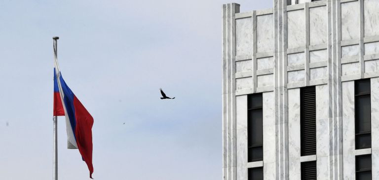 A bird flies past the flag outside the Russian embassy in Washington D.C. on April 15, 2021. A bird flies past the flag outside the Russian embassy in Washington D.C. on April 15, 2021.