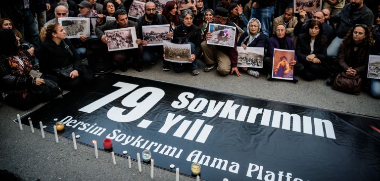 The battle between Turkey and the Kurds isn't just on the physical plane -- there's a major symbolic component as well. People hold pictures depicting victims of the Dersim operation in the 1930s, behind a placard marking the 79th anniversary of the genocide during a demonstration on May 4, 2016 in Istanbul.