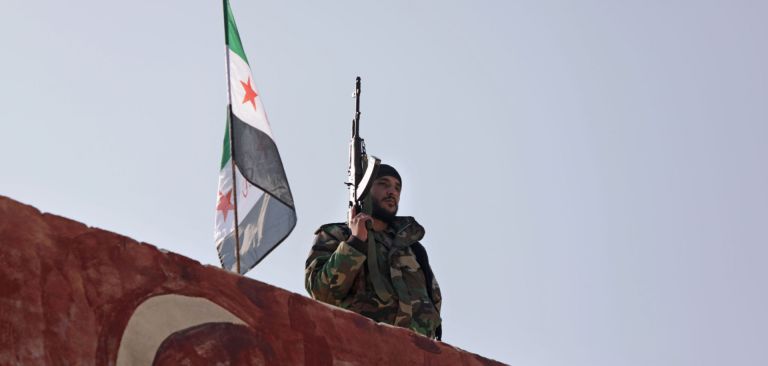 A Turkish-backed fighter guards the rebel-held province of Aleppo in northern Syria on Nov. 17, 2020. A Turkish-backed fighter guards the rebel-held province of Aleppo in northern Syria on Nov. 17, 2020.