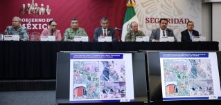 Images of the place where four U.S. citizens were found after being kidnapped in Matamoros, Mexico, are shown on screens during a press conference in Mexico City on March 7, 2023. 