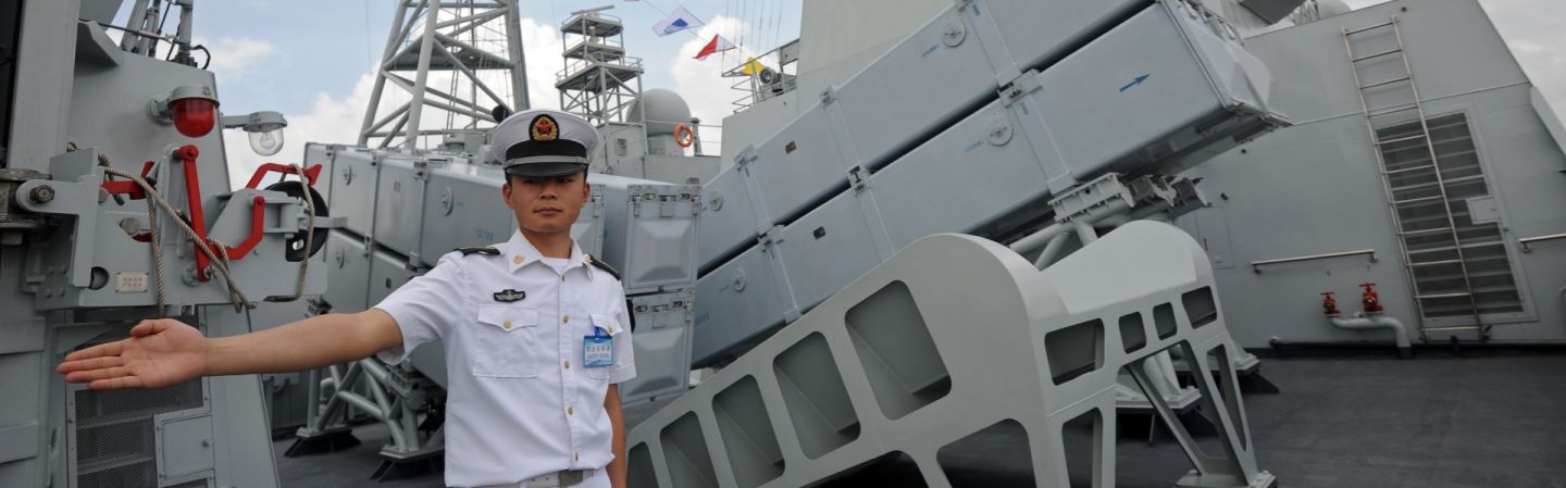 A crew member stands guard on the deck of the Chinese People's Liberation Army Navy ship Wei Fang, docked at the Myanmar International Terminal Thilawa port on the outskirts of Yangon on May 23.