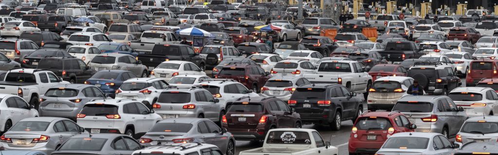 Cars line up on the Mexican side of the San Ysidro crossing port at the U.S.-Mexico border in Tijuana, Mexico, on March 12, 2020.