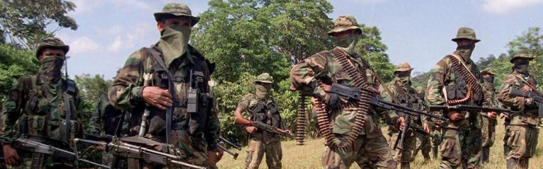 Colombian United Self-Defense Forces (AUC) train Jan. 29, 2000, in the mountains northwest of Bogota. Though the group has officially been disbanded, its parts live on through Colombia's drug trade.