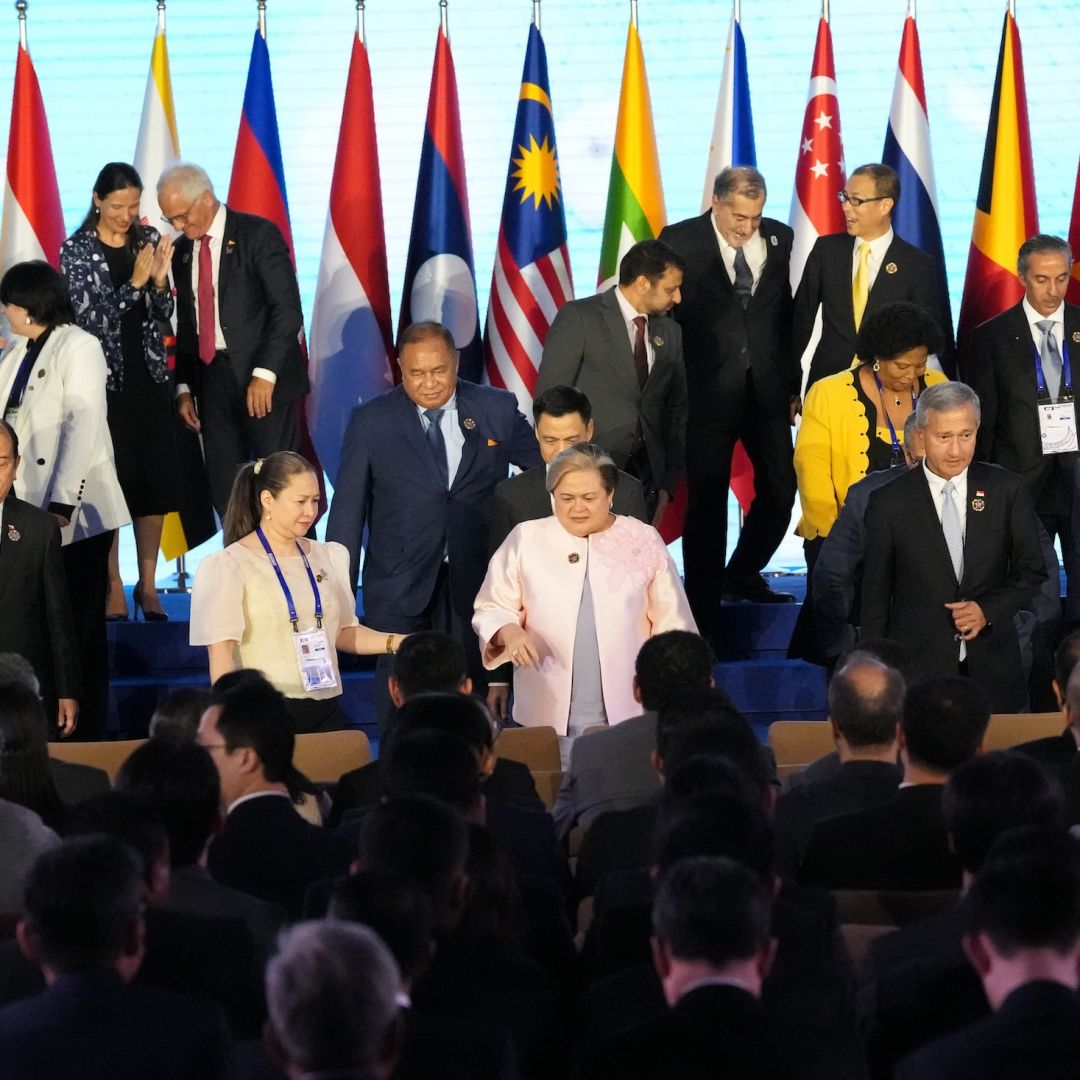 Philippine Foreign Secretary Theresa Lazaro (center) and other leaders leave after a group photo session on the sidelines of the ASEAN Foreign Ministers' Meeting in Manila on July 24, 2026.