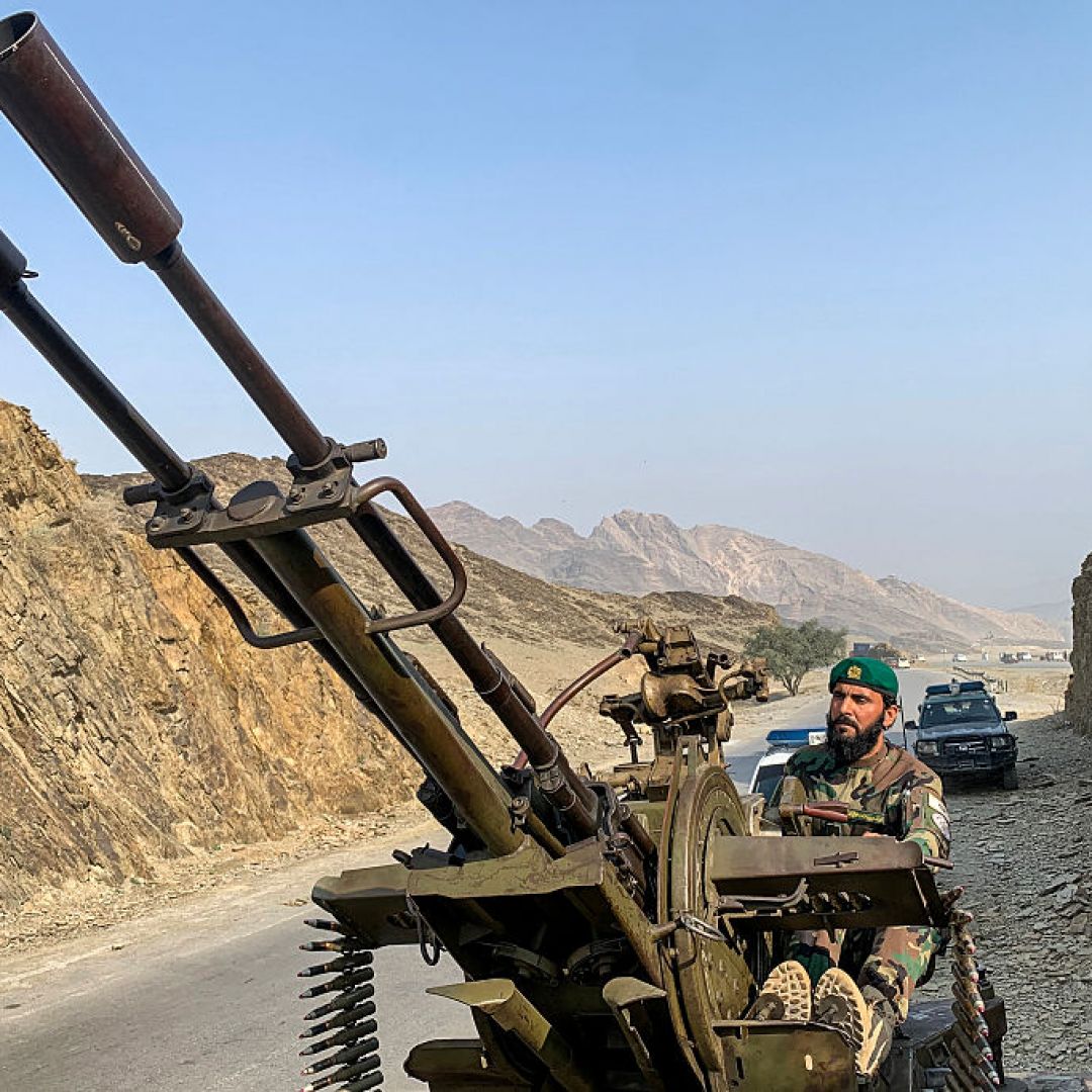 A Taliban security personnel operating an anti-aircraft gun keeps watch for Pakistani airstrikes near the Torkham border crossing between Afghanistan and Pakistan on Feb. 27 in in Nangarhar province, Afghanistan.