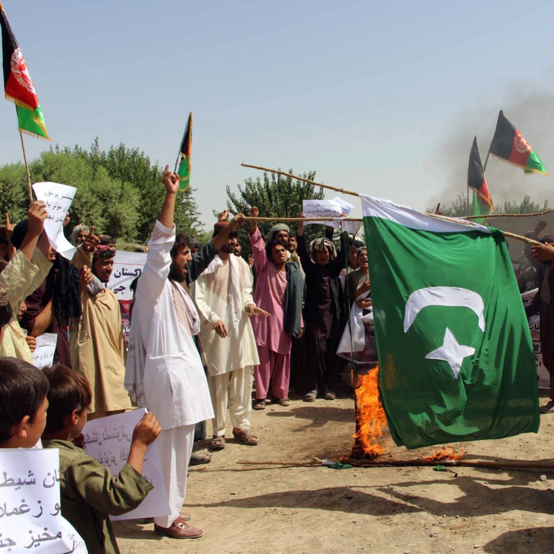 Afghan protesters burn a Pakistani flag during a demonstration in Helmand Province in 2016.