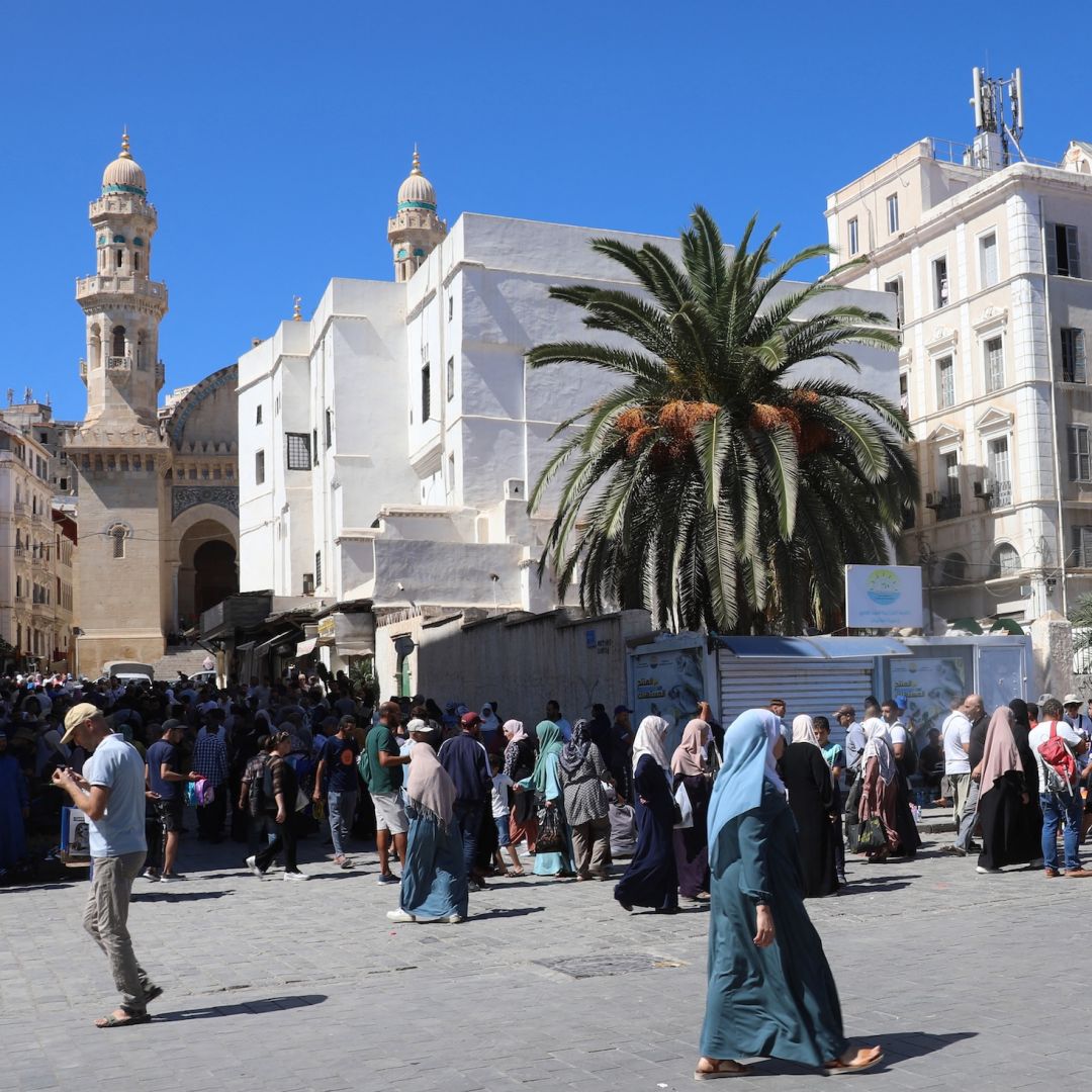 People walk through a main square in Algeria's capital of Algiers on Sept. 15, 2024.