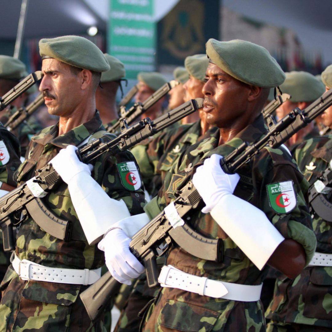 Algerian troops march during a military parade in Tripoli on September 1, 2009 to mark the 40th anniversary since Kadhafi seized power in the north African desert state. Algerian troops march during a military parade in Tripoli on September 1, 2009 to mark the 40th anniversary since Kadhafi seized power in the north African desert state.