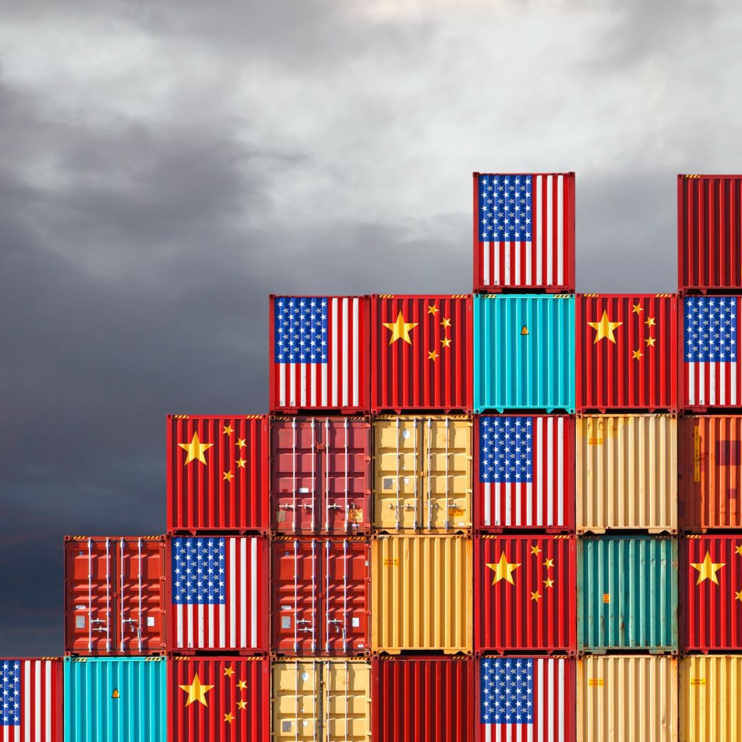 Cargo containers painted with Chinese and U.S. flags.