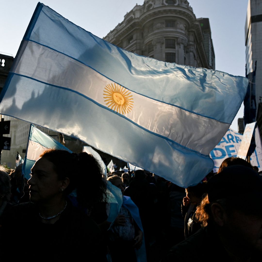 Protesters wave an Argentine flag at an anti-government rally in Buenos Aires on July 9, 2022. Protesters wave an Argentine flag at an anti-government rally in Buenos Aires on July 9, 2022.