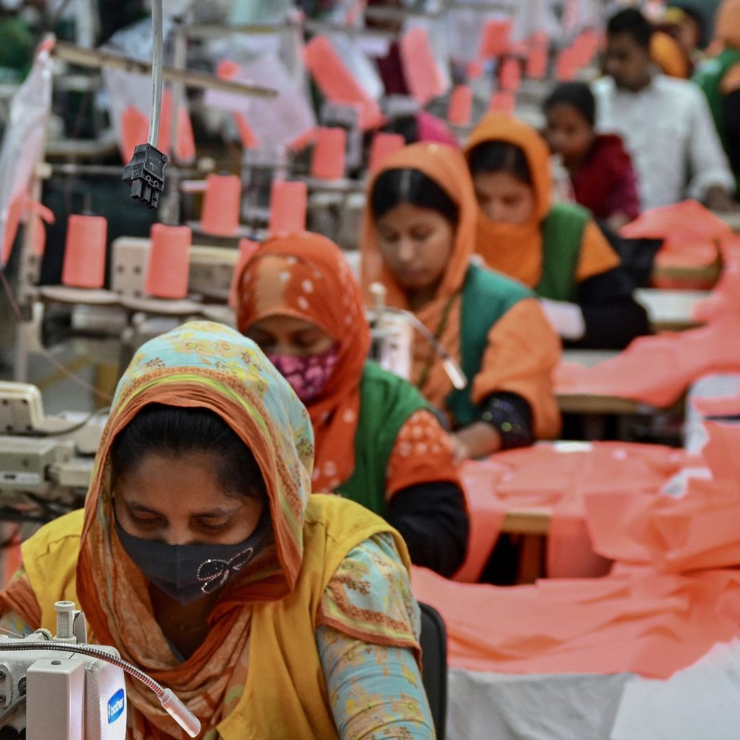 Garment workers sew clothes at a textile factory in Dhaka, Bangladesh, on Dec. 29, 2024. 