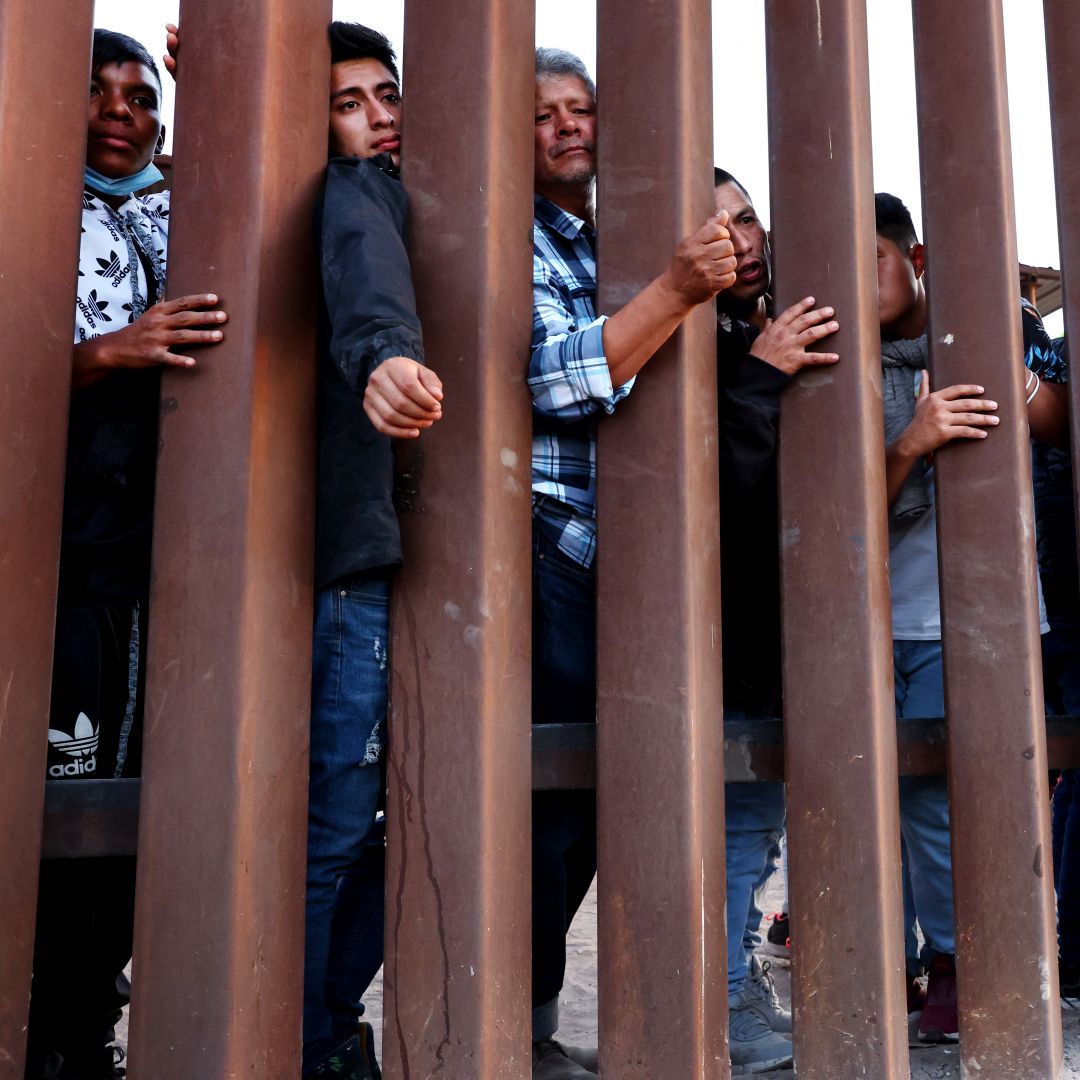 People wait for soup donated by the Yuma County Abolition group after crossing the border from Mexico into San Luis, Arizona, on May 23, 2022. People wait for soup donated by the Yuma County Abolition group after crossing the border from Mexico into San Luis, Arizona, on May 23, 2022.