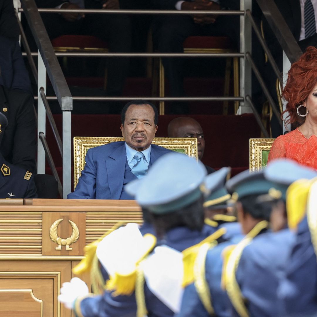 Cameroonian President Paul Biya (left), and his wife Chantal Biya (left) watch a parade marking the 51st celebration of Unity Day in Yaounde on May 20, 2023. 