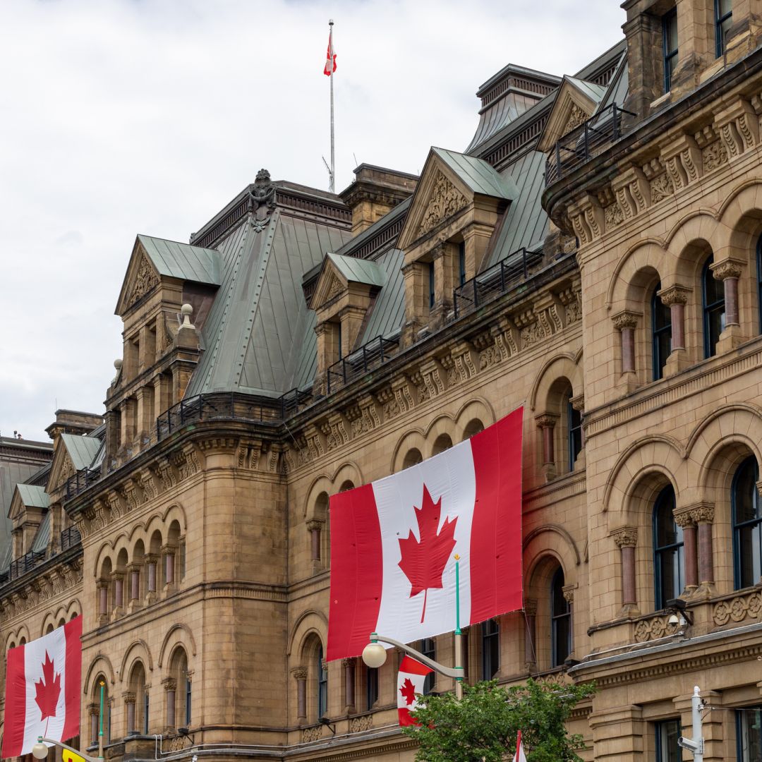 Canadian flags are seen outside a building in Ottawa. 