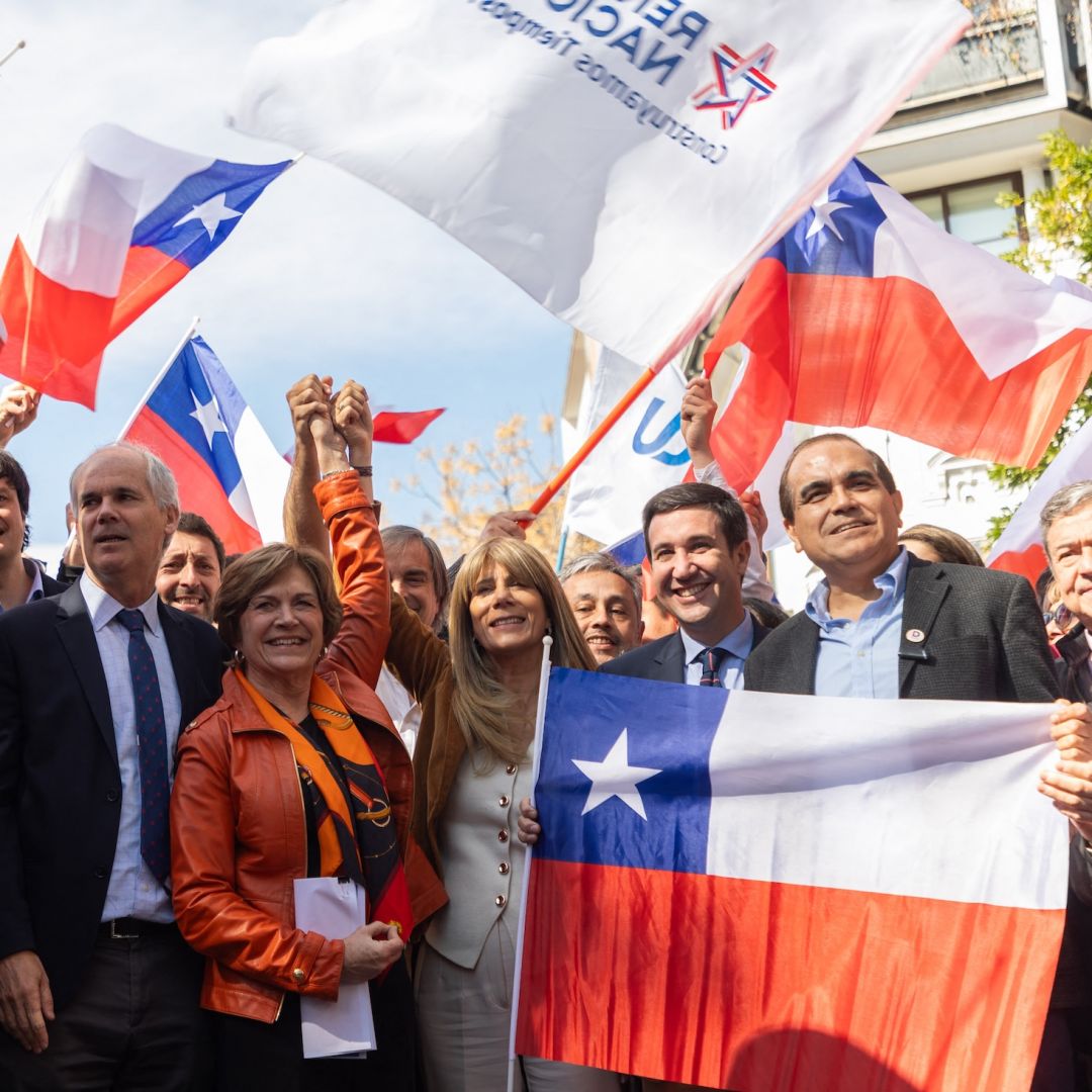 Chile's presidential candidate Evelyn Matthei (C) poses with her team after registering her candidacy at the Electoral Service of Chile in Santiago on Aug. 16, 2025.