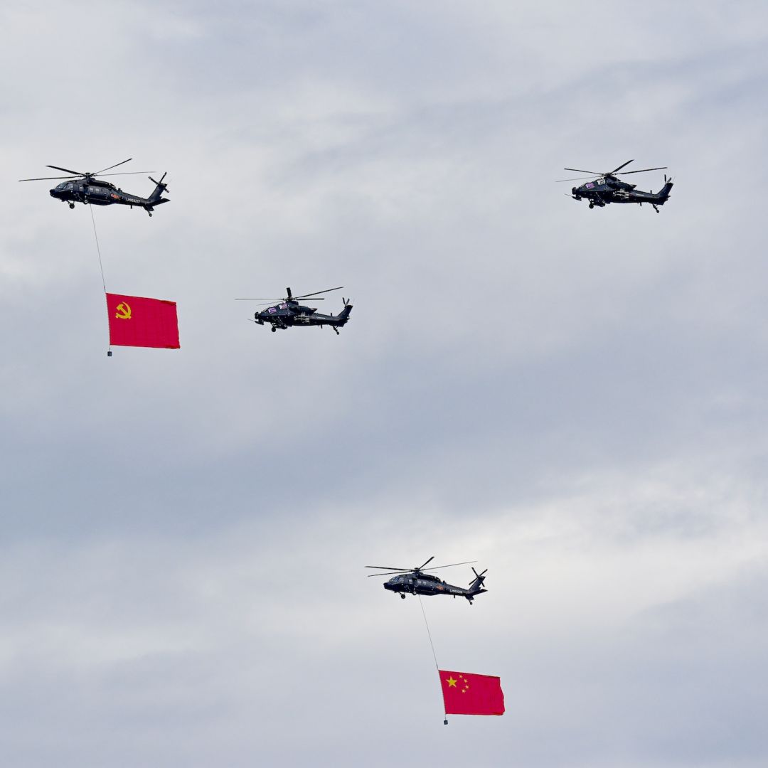 Helicopters fly in the sky during a rehearsal for a military parade Aug. 24 in Beijing. Helicopters fly in the sky during a rehearsal for a military parade Aug. 24 in Beijing.