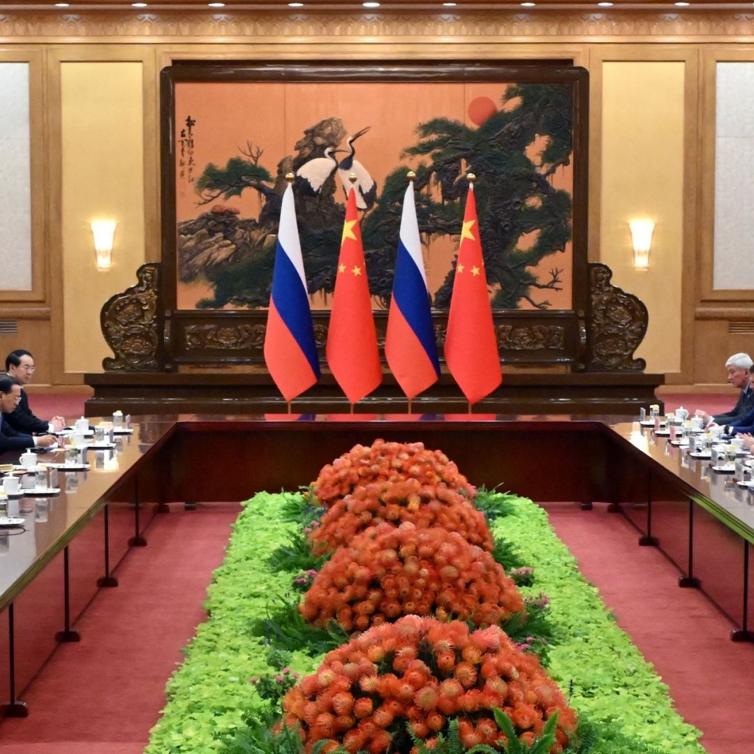 Russian President Vladimir Putin (right) and Chinese President Xi Jinping (left), surrounded by their respective delegations, hold a meeting in Beijing, China, on Oct. 18, 2023. 